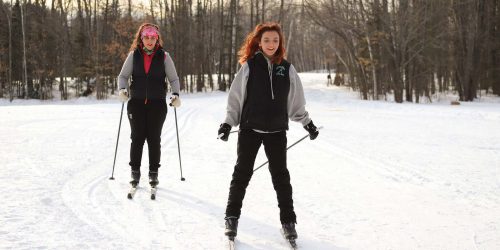 Cross Country Skiing - Find scenic trails | Mom and daughter cross-country skiing Northwood Ski Trails