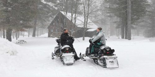 snowmobilers getting ready to ride – Oaken Bucket Cottages