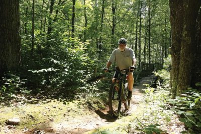 Recomended Article: Options for spring entertainment in Rhinelander | Man mountain biking the Washburn Lake Silent Sports Trails Area