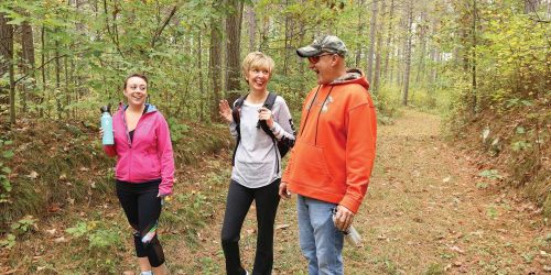 3 friends hiking Cassian County Two Way Trail