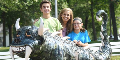 Family with Hodag statue outside Oneida County Courthouse Rhinelander WI